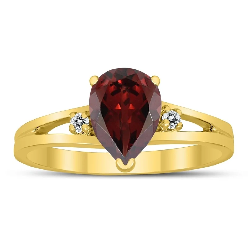 8X6MM Garnet and Diamond Pear Shaped Open Three Stone Ring in 10K Yellow Gold