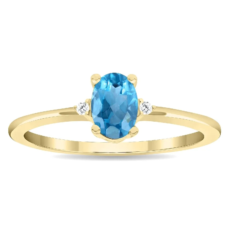 Women's Oval Shaped Blue Topaz and Diamond Classic Band in 10K Yellow Gold